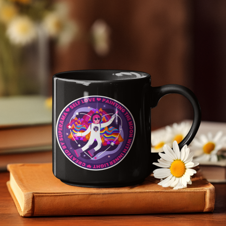 ai-generated-mockup-featuring-a-mug-placed-over-a-book-with-some-flowers-m36605 (1)